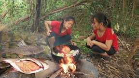 Two sisters catch fish in river and Cook for dinner, Survival in rainforest