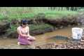 Girl uses bamboo cage and net to